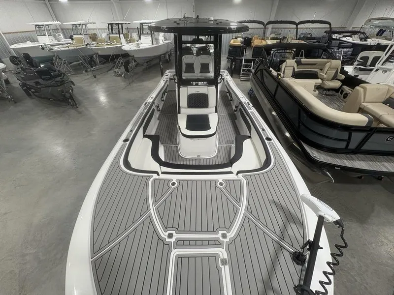Slide: The Image of 2026 Tidewater 2700 CB boat in showroom, featuring sleek design and spacious deck. - 40