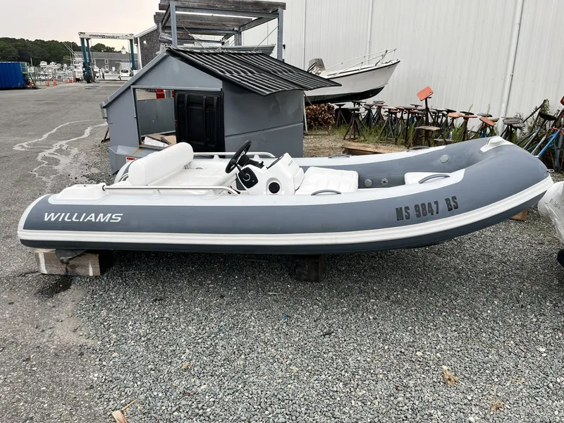 The Image of 2022 Williams Jet Tenders Sportjet 395, gray and white, parked on gravel. - 0