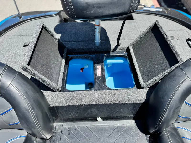 Slide: The Image of 2024 Tracker Z17 boat interior with open storage compartments and seating. - 15