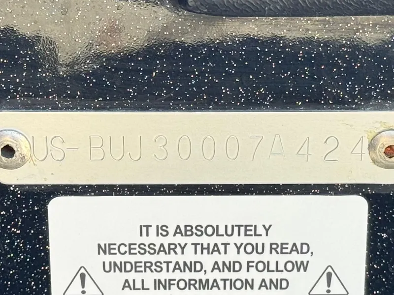 Slide: The Image of 2024 Tracker Z17 hull identification number with safety warning label. - 21