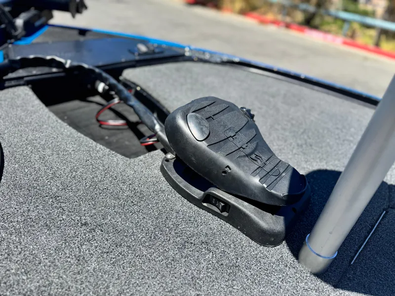 Slide: The Image of 2024 Tracker Z17 boat deck with foot pedal control, close-up view. - 9
