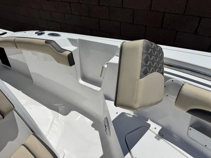 Slide: The Image of 2022 Tidewater 232 CC boat interior with beige seating and modern design. - 14