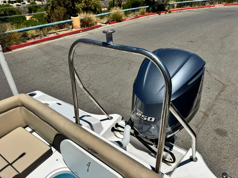 Slide: The Image of 2022 Tidewater 232 CC boat with Yamaha 250 engine, parked on a sunny day. - 23