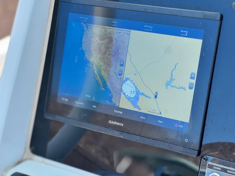 Slide: The Image of Garmin navigation display on 2022 Tidewater 232 CC boat, showing map and route details. - 26