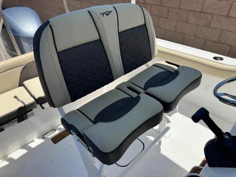 Slide: The Image of 2022 Tidewater 232 CC boat seat with dual-tone cushioned design. - 27