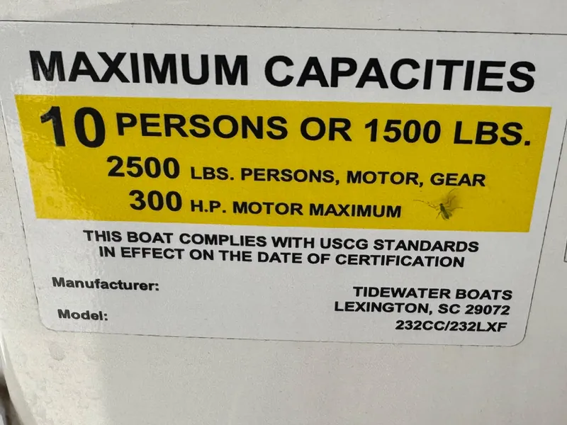 Slide: The Image of Tidewater 232 CC 2022 boat capacity label: 10 persons, 2500 lbs, 300 HP motor. - 31