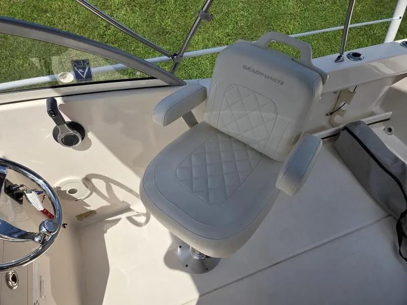 Slide: The Image of Captain's chair on 2018 Grady-White Freedom 215 boat, featuring quilted upholstery. - 10