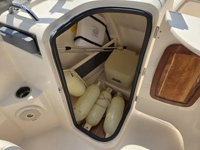 Slide: The Image of Storage compartment of 2018 Grady-White Freedom 215 boat with fenders and equipment. - 12