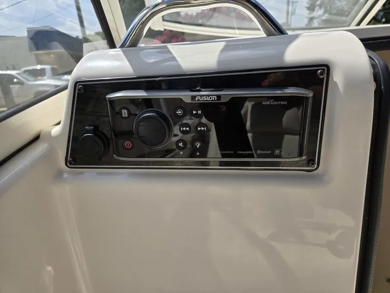 Slide: The Image of Fusion audio system on 2018 Grady-White Freedom 215 boat dashboard. - 13