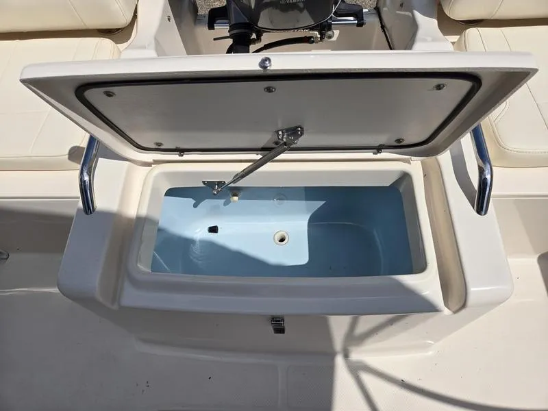 Slide: The Image of Open storage compartment on 2018 Grady-White Freedom 215 boat. - 6