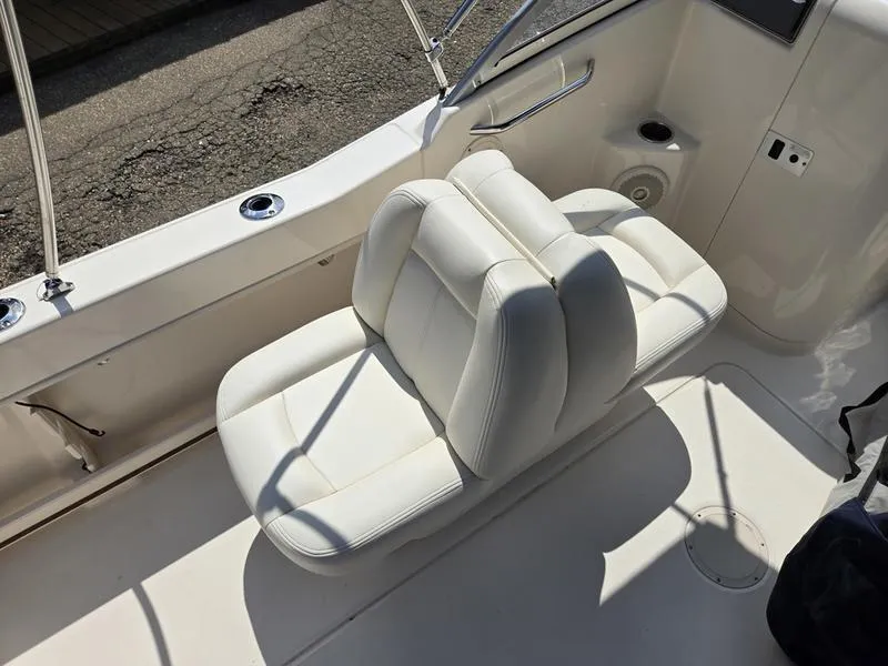 Slide: The Image of 2018 Grady-White Freedom 215 boat with white cushioned seating. - 8