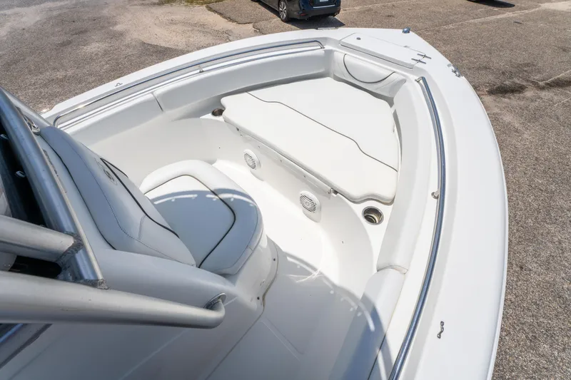 Slide: The Image of 2014 Sea Hunt 196 Ultra Center Console boat interior with seating and storage. - 15