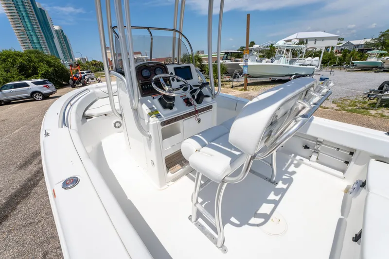 Slide: The Image of 2014 Sea Hunt 196 Ultra Center Console boat with modern helm and seating. - 16