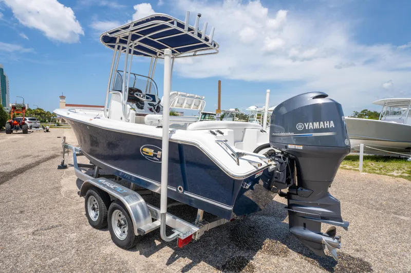 Slide: The Image of 2014 Sea Hunt 196 Ultra Center Console boat with Yamaha outboard on trailer. - 5