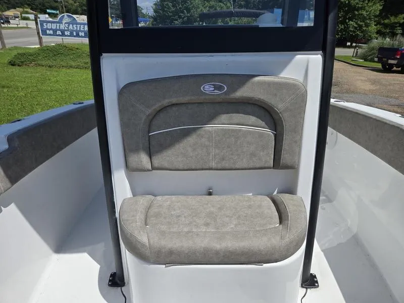 Slide: The Image of 2026 Sea Hunt Ultra 245SE boat seat with gray upholstery and logo. - 10