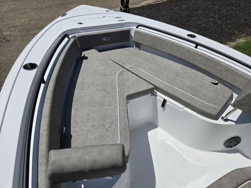 Slide: The Image of 2026 Sea Hunt Ultra 245SE boat interior with gray cushioned seating. - 11