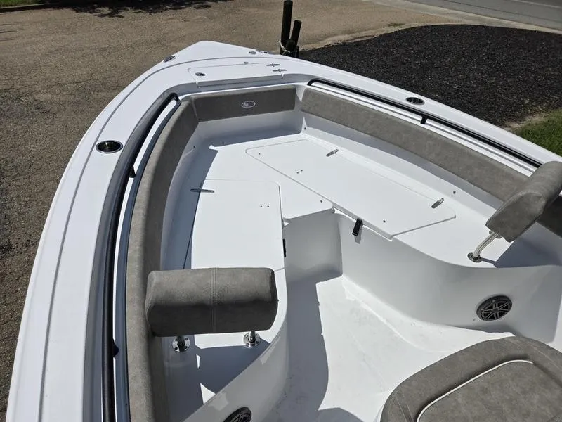 Slide: The Image of 2026 Sea Hunt Ultra 245SE boat interior with cushioned seating and storage compartments. - 13