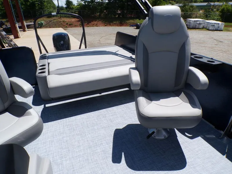 Slide: The Image of 2025 Premier 220 SUNSCAPE RL boat interior with gray seating and modern design. - 11