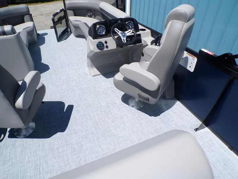 Slide: The Image of 2025 Premier 220 SUNSCAPE RL boat interior with modern seating and steering console. - 12