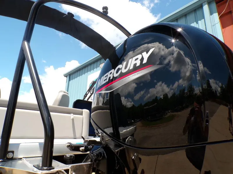 Slide: The Image of 2025 Premier 220 SUNSCAPE RL with Mercury engine, reflecting sky and clouds. - 5