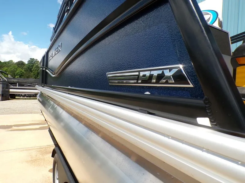 Slide: The Image of 2025 Premier 220 SUNSCAPE RL boat side view with PTX logo. - 7
