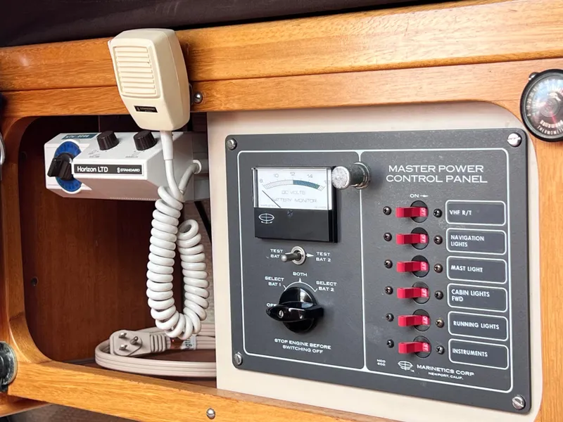 Slide: The Image of Vintage 1978 Aphrodite 101 boat control panel with radio and power switches. - 17