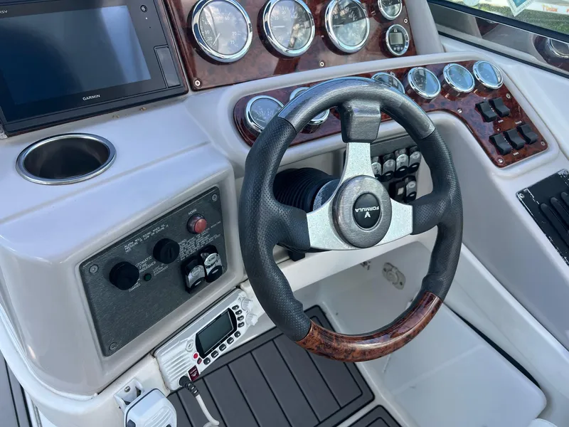 Slide: The Image of Dashboard of a 2004 Formula 280 Bowrider boat with steering wheel and gauges. - 10