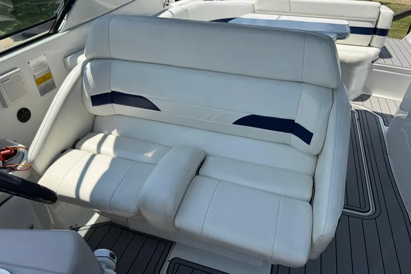 Slide: The Image of 2004 Formula 280 Bowrider interior with white and blue seating, showcasing luxury design. - 25