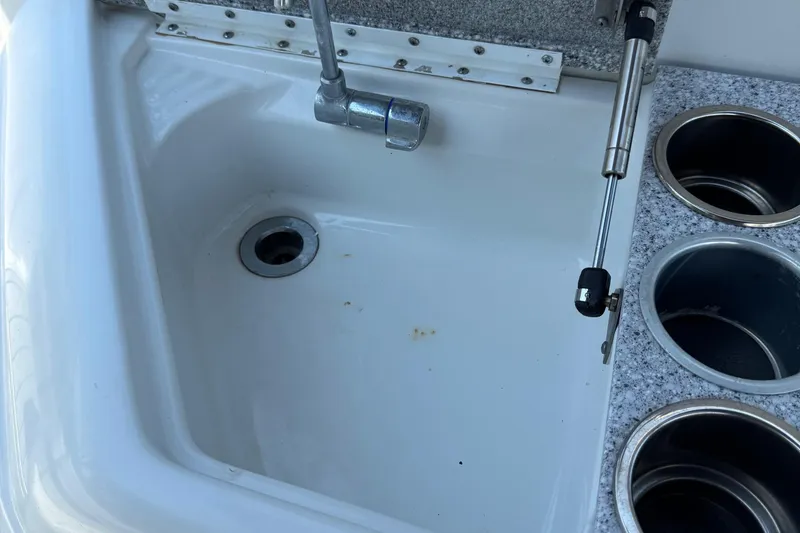 Slide: The Image of 2004 Formula 280 Bowrider sink and cup holders on deck. - 27