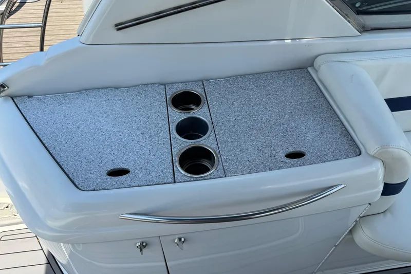 Slide: The Image of 2004 Formula 280 Bowrider boat interior with cup holders and seating area. - 28