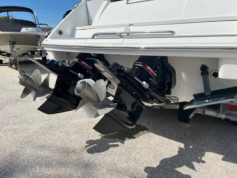 Slide: The Image of 2004 Formula 280 Bowrider boat with dual Mercury outboard engines and propellers. - 3