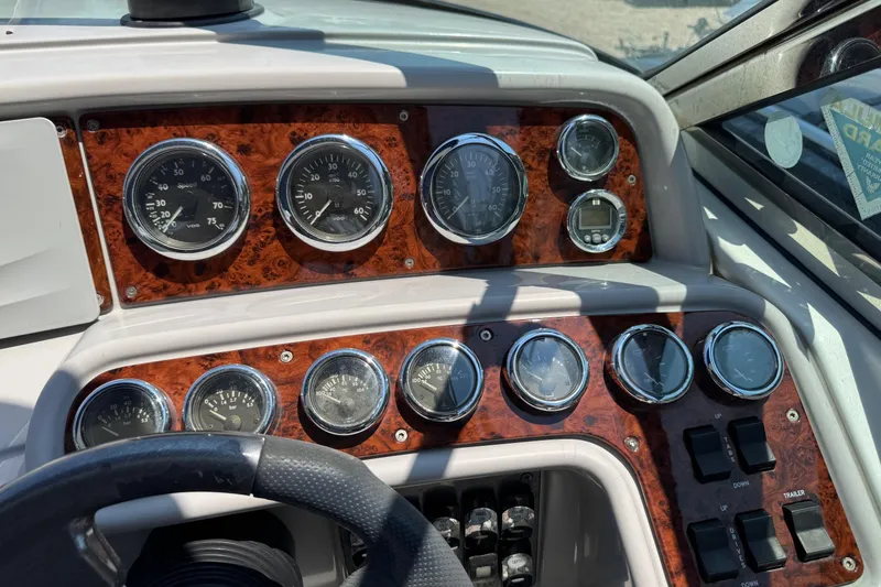 Slide: The Image of Dashboard of a 2004 Formula 280 Bowrider boat with gauges and controls. - 30