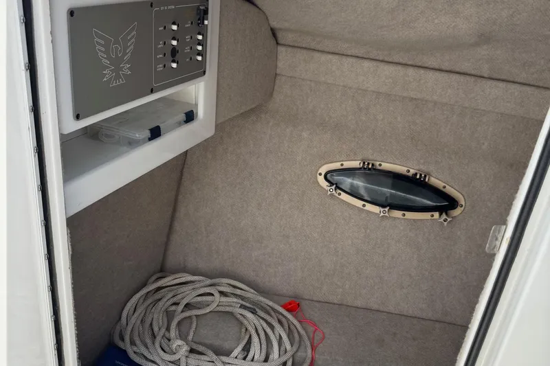 Slide: The Image of Interior of 2004 Formula 280 Bowrider boat with control panel and storage. - 34