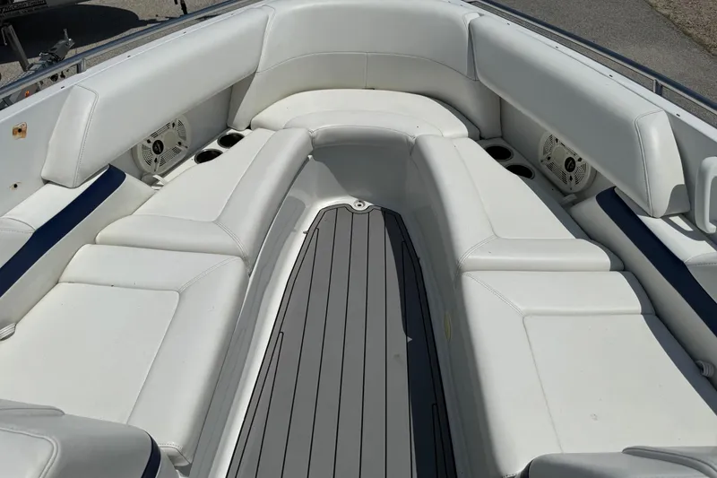 Slide: The Image of 2004 Formula 280 Bowrider interior with white seating and cup holders. - 38