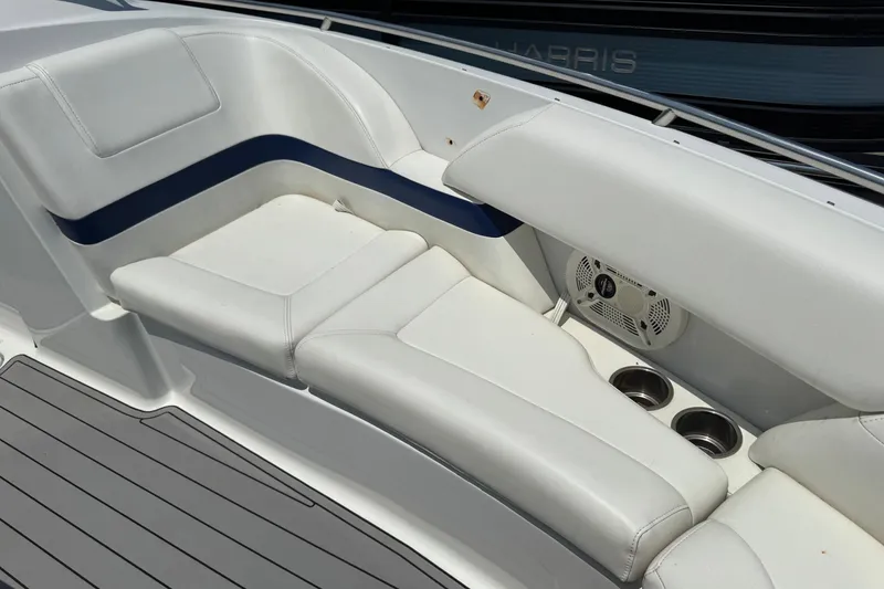 Slide: The Image of 2004 Formula 280 Bowrider boat interior with white seating and cup holders. - 40