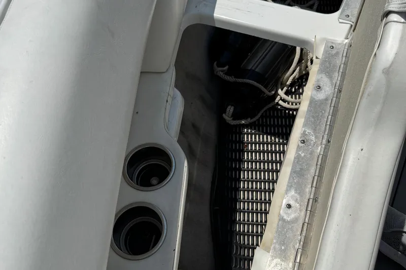 Slide: The Image of Interior of a 2004 Formula 280 Bowrider boat showing cup holders and storage area. - 42