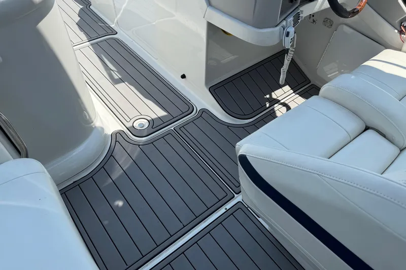 Slide: The Image of 2004 Formula 280 Bowrider interior with sleek gray flooring and white seating. - 45