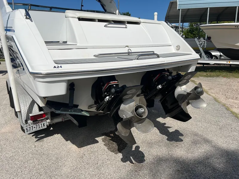 Slide: The Image of 2004 Formula 280 Bowrider boat with dual propellers on a trailer. - 5