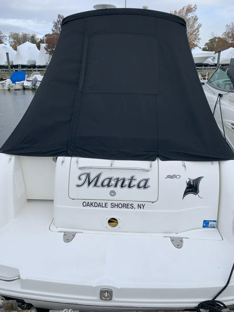 Slide: The Image of 2006 Sea Ray 260 Sundancer boat named "Manta" docked at Oakdale Shores, NY. - 1
