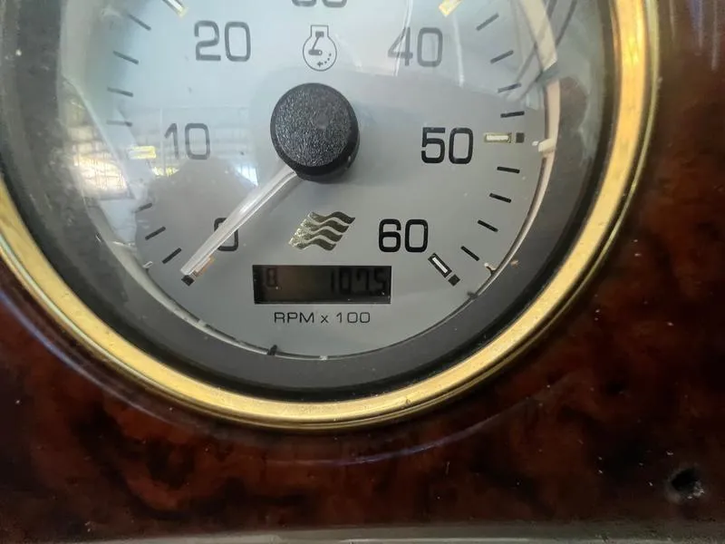 Slide: The Image of Close-up of a 2004 Four Winns 378 tachometer showing 1075 RPM. - 13
