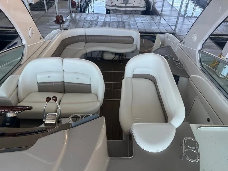 Slide: The Image of Interior of a 2004 Four Winns 378 boat with white and gray seating. - 16