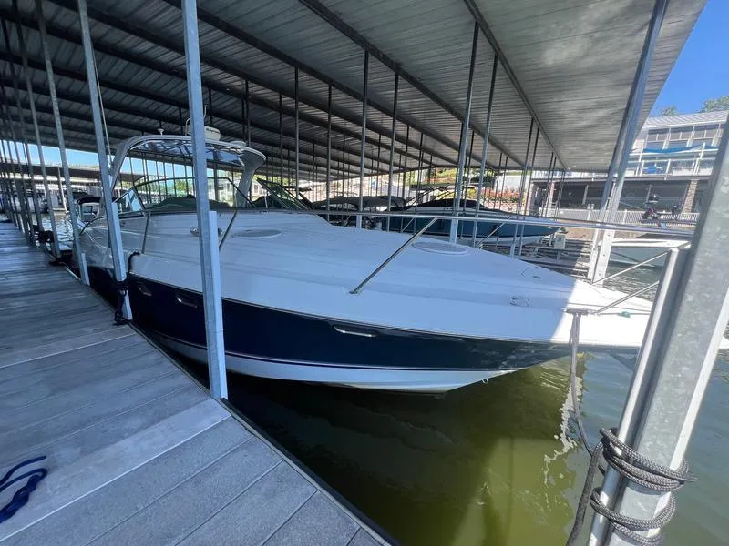 Slide: The Image of 2004 Four Winns 378 boat docked in a covered marina. - 7