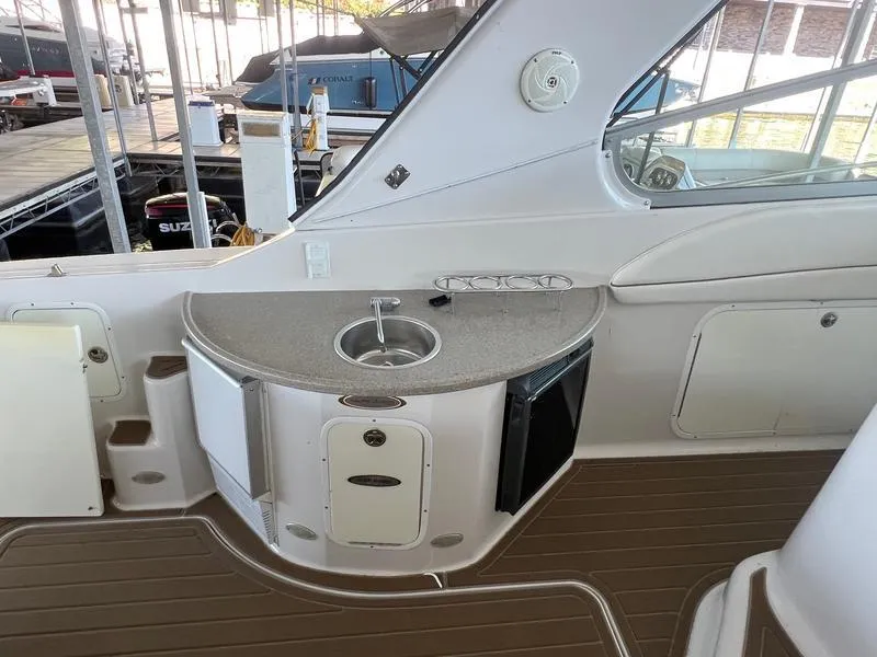 Slide: The Image of 2004 Four Winns 378 yacht interior with sink and storage area. - 9
