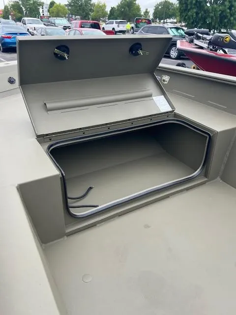 Slide: The Image of Open storage compartment in 2026 Tracker Grizzly 1650 T Prairie Wings Edition boat. - 5