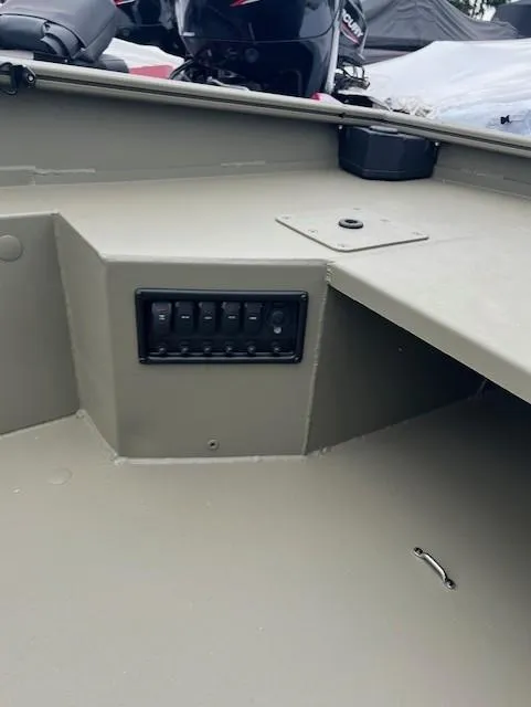 Slide: The Image of 2026 Tracker Grizzly 1650 T Prairie Wings Edition boat interior with control panel. - 6