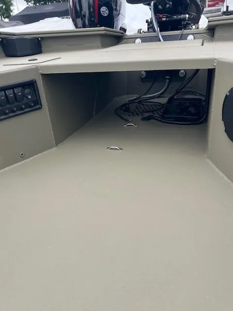 Slide: The Image of 2026 Tracker Grizzly 1650 T Prairie Wings Edition boat interior with control panel and wiring. - 7