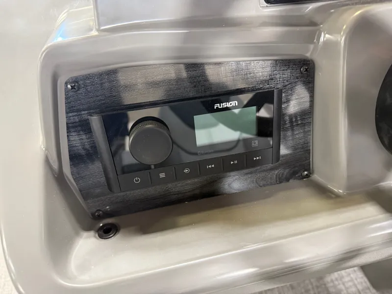 Slide: The Image of Fusion audio system on 2025 Tahoe Sport 2385 Swingback boat dashboard. - 12