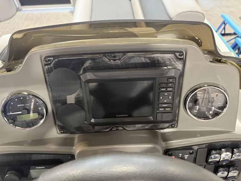 Slide: The Image of Dashboard of 2025 Tahoe Sport 2385 Swingback with Garmin display and gauges. - 13