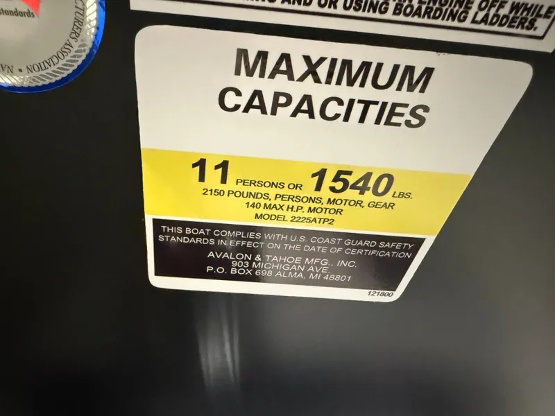 Slide: The Image of 2025 Tahoe Sport 2385 Swingback capacity label: 11 persons or 1540 lbs, 140 HP max. - 15