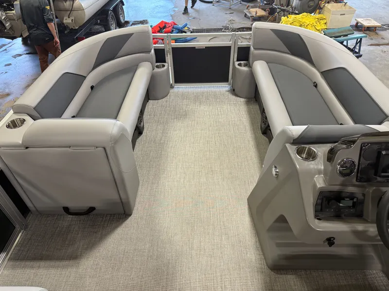 Slide: The Image of 2025 Tahoe Sport 2385 Swingback interior with gray seating and modern dashboard. - 27